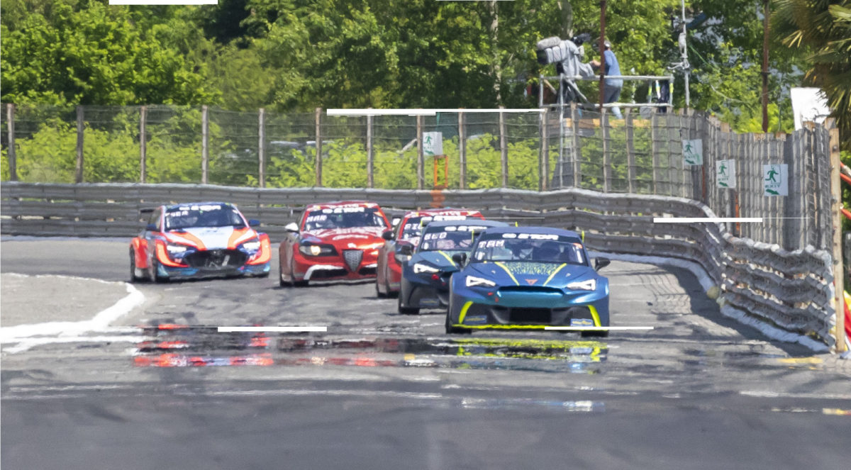 CUPRA race cars on the track in the heat haze