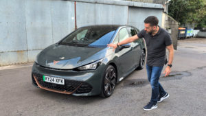 CUPRA Born VZ with a man pointing at the bonnet